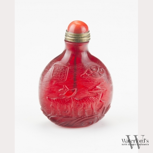 A Carved Ruby Red Peking Glass Snuff Bottle