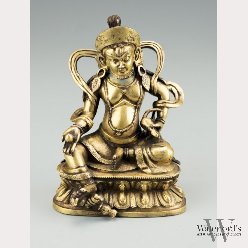 A Sino-Tibetan Gilt Bronze Jambhala