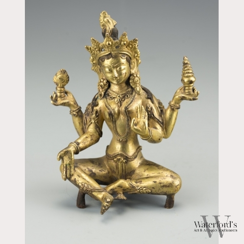 A Sino-Tibetan Gilt Copper Four-Armed Green Tara