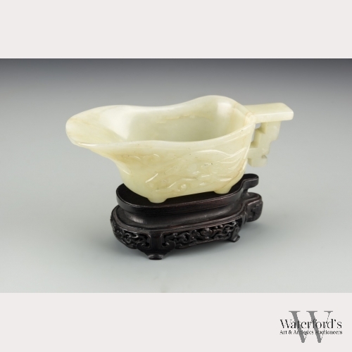 A Chinese White Jade Libation Cup with Stand