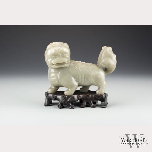 A Large Chinese Celadon Jade Lion with Stand