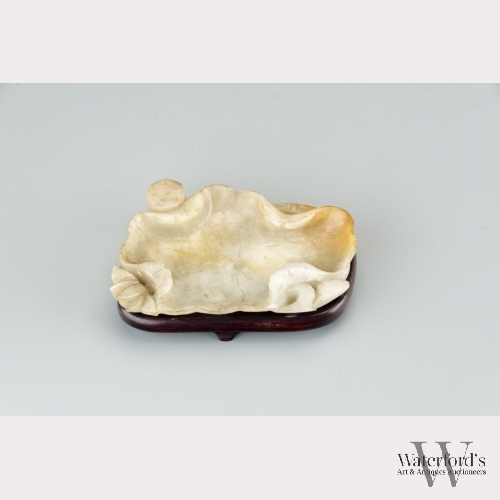 A Chinese White Jadeite Lotus Leaf Pallet