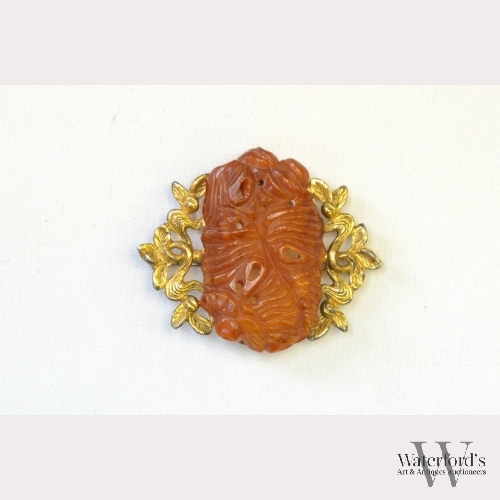 A Chinese Carved Beeswax Broach