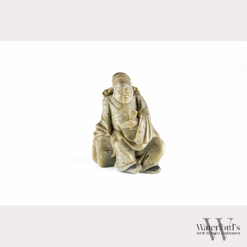 A Chinese Soapstone Carving of a Scholar