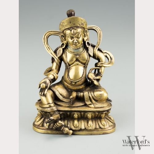 A Sino-Tibetan Gilt Bronze Jambhala