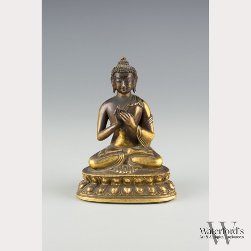 A Small Bronze Statue of Sitting Buddha