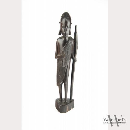 An African Carved Wood Figure of a Hunter