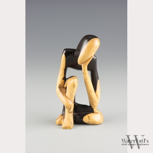 A Small Wooden Sculpture of Abstract Human Figure