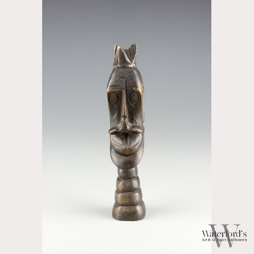 A Carved Wooden Sculpture of a Head