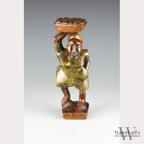 An African Carved Wooden Figure of Woman