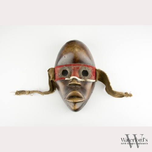An African Carved Wood Mask of the Dan People